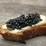 Beluga caviar on bread with butter