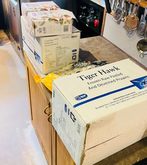 Fishmonger London 56 Frozen Raw Peeled & Deveined Prawns Delivery in a restaurant's kitchen